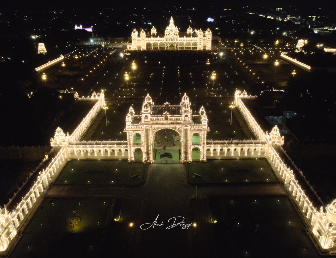 Mysuru Dasara celebration with illuminated Mysore Palace.